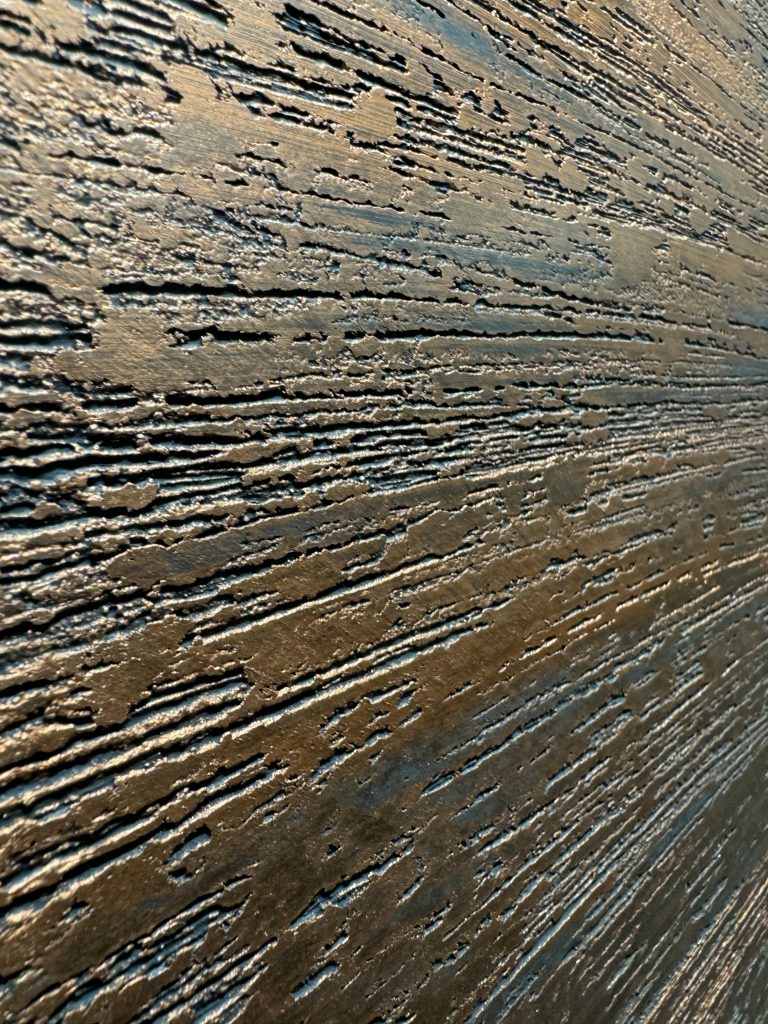 This dragged finish with a copper tone adds style to any area